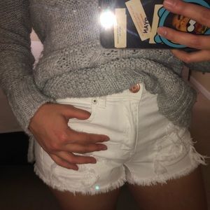 White ripped shorts